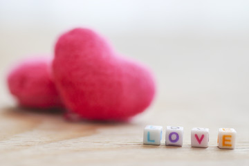 Stock Photo:.Love on colorful dice and beautiful wooden table.