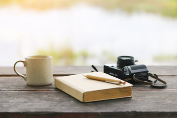 Stock Photo:.Vintage,retro of note book and pencil with camera o