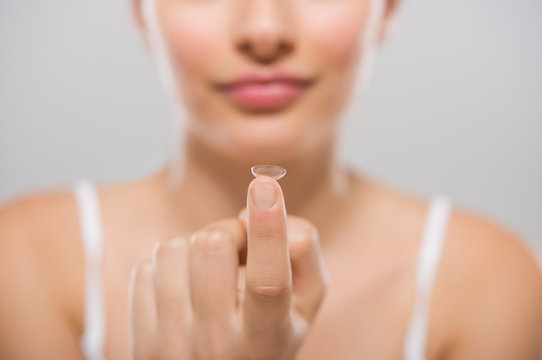 Woman Holding Contact Lens