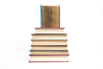 a pyramid from books with color covers