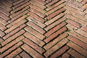 Herringbone pavement with old bricks in the Piazza del Campo. Siena, Tuscany, Italy