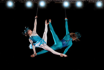 Young couple circus air gymnast