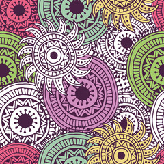 Ethnic seamless pattern with feathers and circles.
