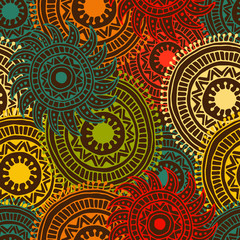 Ethnic seamless pattern with feathers and circles.