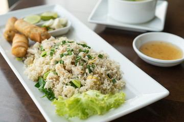 Fried rice with salted fish and fried spring rolls.