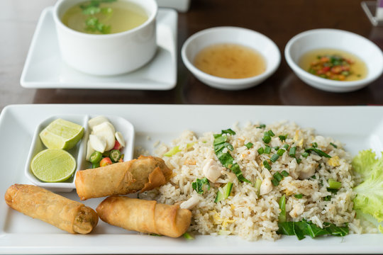 Fried rice with salted fish and fried spring rolls.