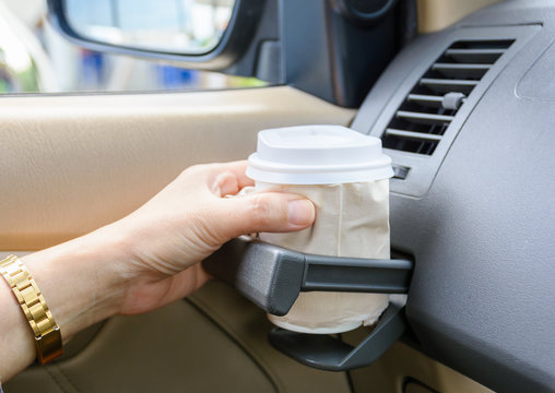 Hot Coffee To Go At Cup Holder In A Car.