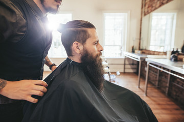 Man sitting at hair salon