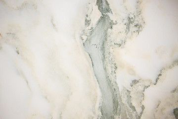 Lightened slices marble onyx. Horizontal image. Warm green colors. Beautiful close up background