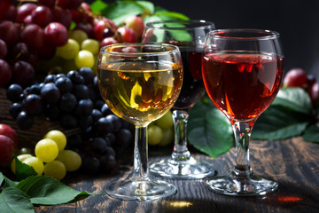 assortment of wine on wooden background, closeup