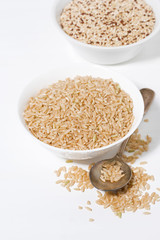brown rice and quinoa in a bowl on a white background, vertical