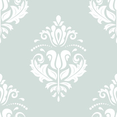 Elegant classic pattern. Seamless abstract background with repeating elements. Light blue and white pattern