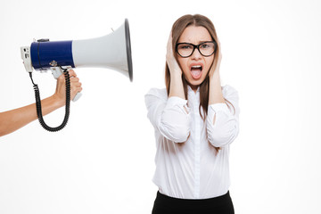 Naklejka premium Boss with megaphone yelling at female colleague