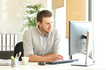 Businessman working with a computer at office