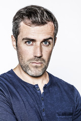 Fototapeta premium portrait, young handsome bearded man with blue eyes and freckles