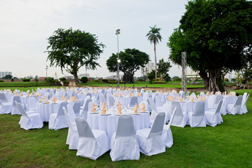 gorgeous wedding chair and table setting for fine dining at outd