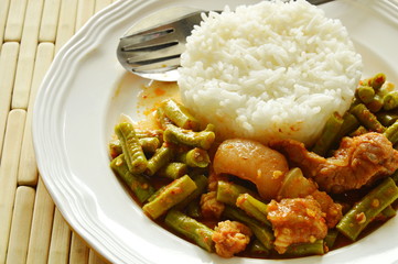 spicy stir fried fat pork and yard long bean curry eat couple with rice