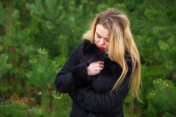 Naklejka premium Woman posing in pines