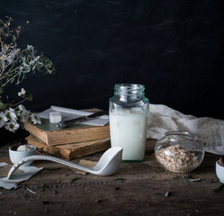 rustic breakfast. still life, vintage. the book chrysanthemums, the milk bank. black background. space for text