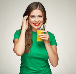 healthy smiling woman holds glass with orange juice.
