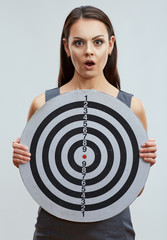 Portrait of emotional business woman holding darts target.