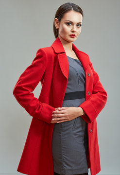 Portrait Of Confident Business Woman Dressed In Red Coat.