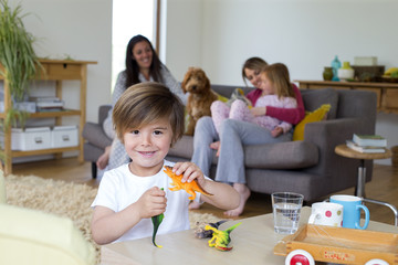 Obraz na płótnie Canvas Boy with Toy Dinosaurs