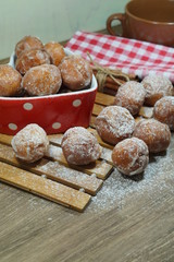 Sweet donuts in a dish in the shape of heart. Fat Thursday Slavic culture 
