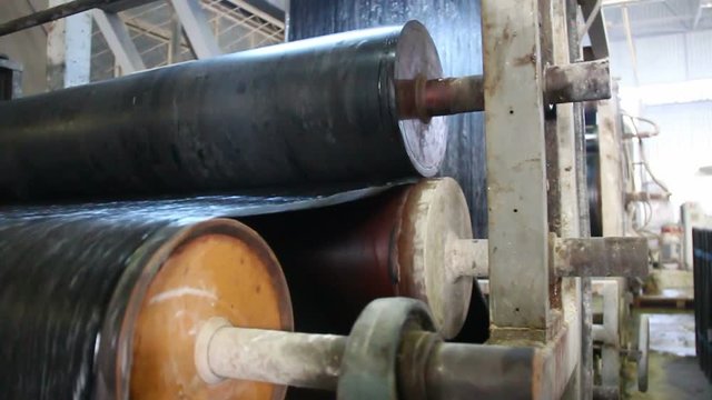 Production of bitumen roll. Rolling conveyors in a factory.