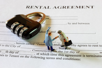 The little gentlemen are making commitment on rental agreement contract.