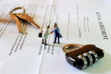 The little gentlemen are making commitment on rental agreement contract.