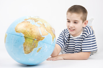 young boy holding world map globe