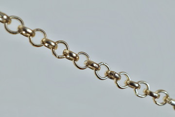 Fototapeta premium Isolated macro detail of a fashionable chain used as decorate accessory as necklace or bracelet