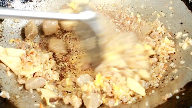 frying  rice and with meatball,  egg,  pleurotus eryngii in pan