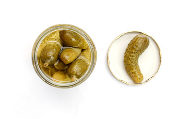 glass jar with pickled cucumbers on white background