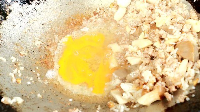 frying  egg pleurotus eryngii with meatball in pan
