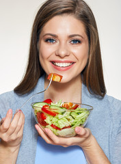 Woman eating salad. Close up face portrait.