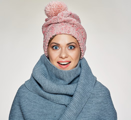 Smiling woman wearing warm winter clothes.