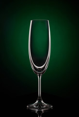 Empty wine glass on dark red