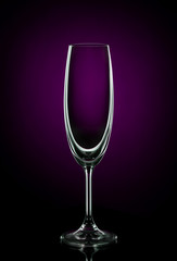 Empty wine glass on dark red