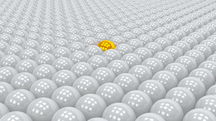 Gold ball in grey ones