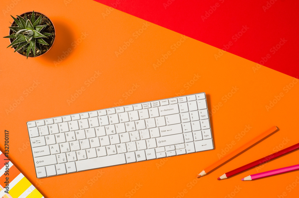 Poster computer workspace with keyboard on colorful office table or desk seen from above. top view product 