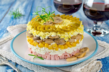 Layered salad with ham, mushrooms and corn