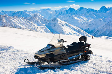 Mountain day winter. Elbrus. Snow scooter