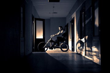 big man on bike in the office