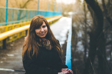 Girl on the bridge in winter