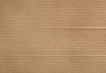 Fototapeta na wymiar background and texture of brown paper corrugated sheet board surface