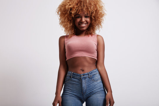 portrait of young black woman with blonde hair and curvy body