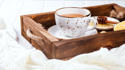 Cup of Ginger Tea with Lemon and Honey on a White Background.Concept Of Healthy Eating. Copy space.  selective focus.