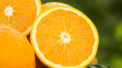 Sweet fresh oranges in natural light on old wood